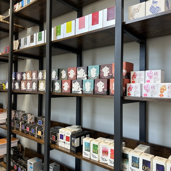 View inside The Gentleman Stationer shop of shelves of bottled fountain pen ink in a variety of colors from brands including Pilot, Teranishi, Taccia, Diamine, Tom's Studio, and Lamy.